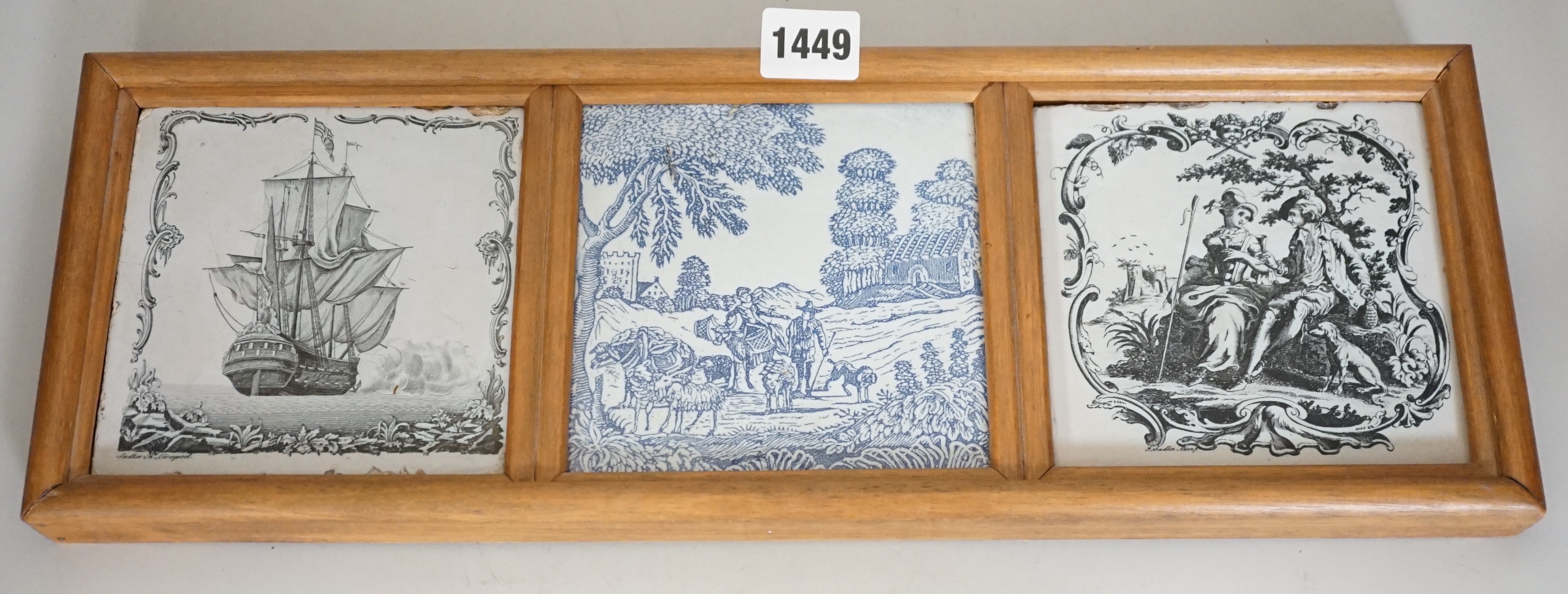 Two John Sadler Liverpool delftware black transfer printed tiles, c.1770 and a blue printed tile, in the same wooden mount. Overall 16 x 45cm